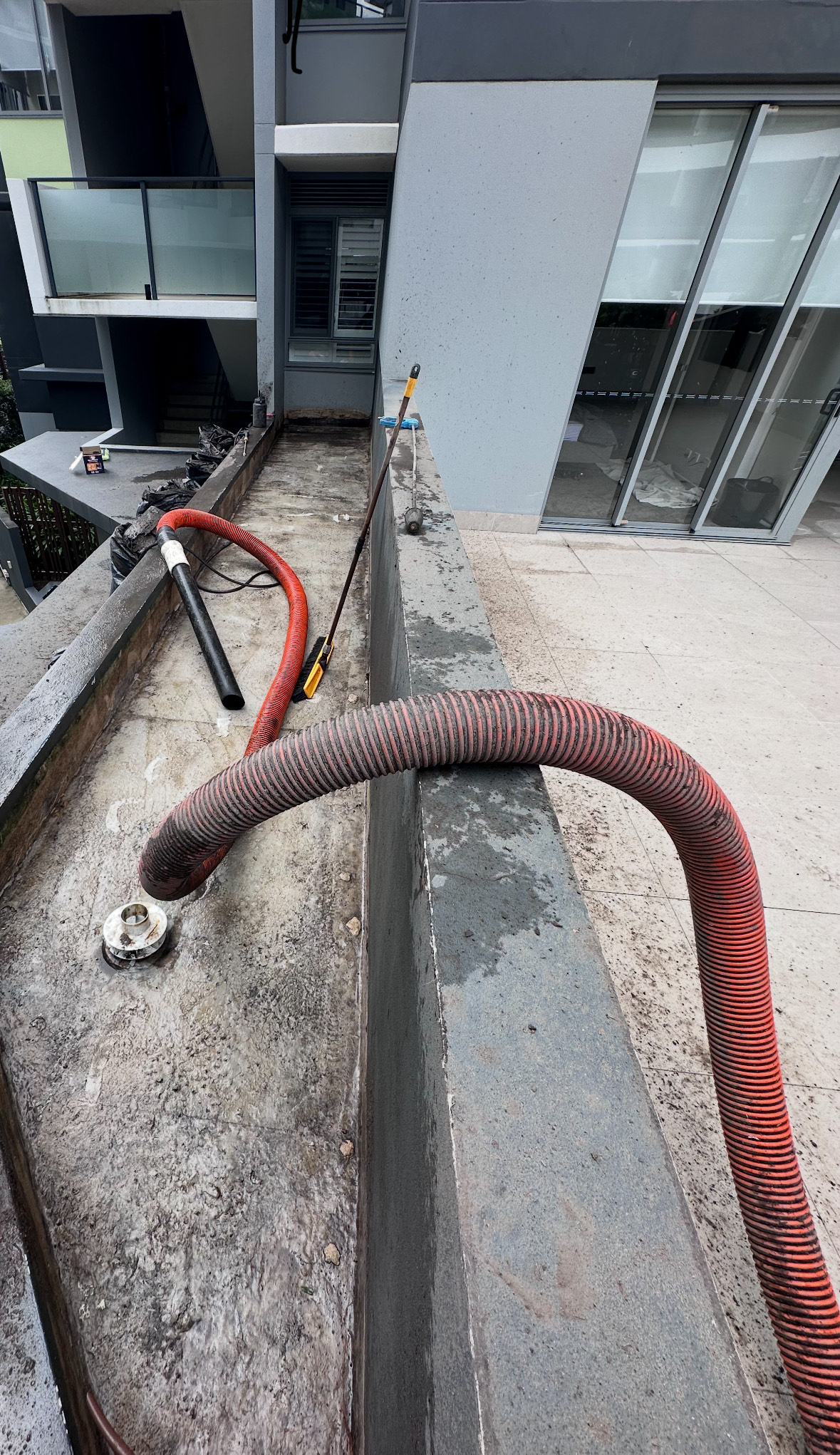Rooftop planter box mud removal in Nundah